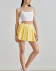 DUNIQ TENNIS & PADEL SKIRT - LIGHT YELLOW - SQOON